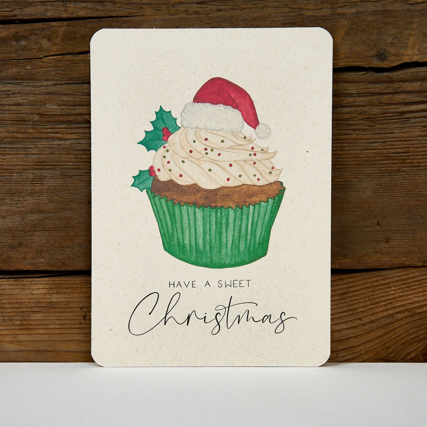 Postkarte "Cupcake Weihnachtsmütze"